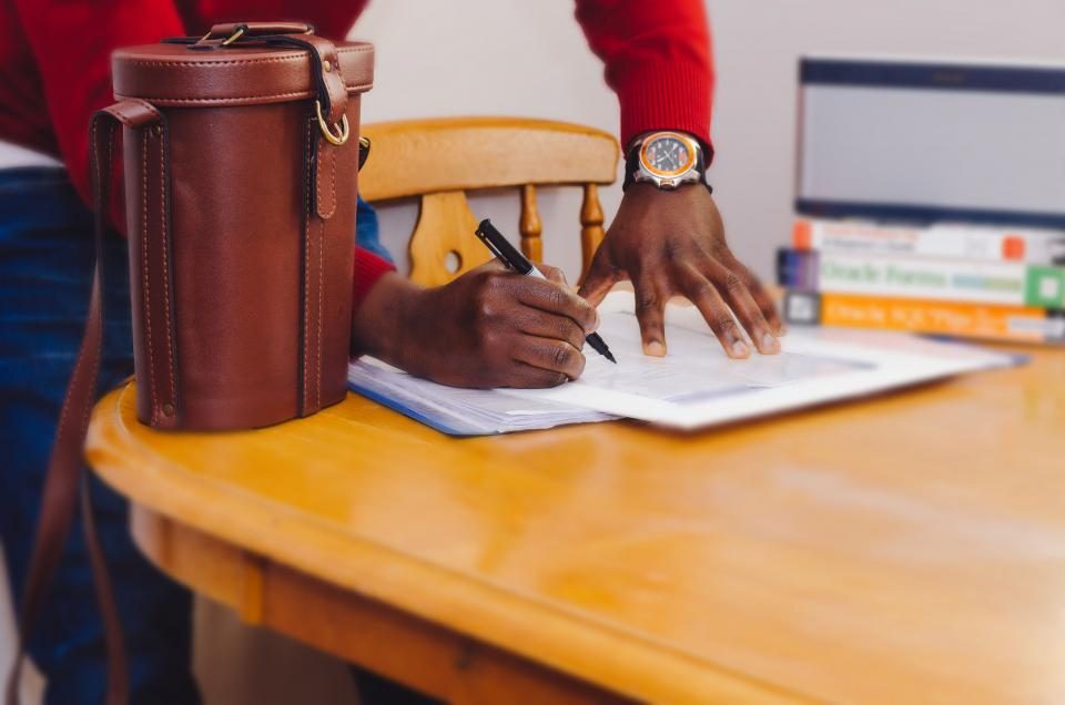 A professional at work at a desk — the one who knows best what to make now stands in front