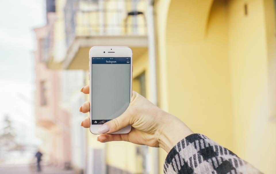 A screen in the hand — the apps we hold and use every day, with a long chain always behind them